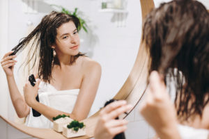 woman-putting-product-in-her-hair