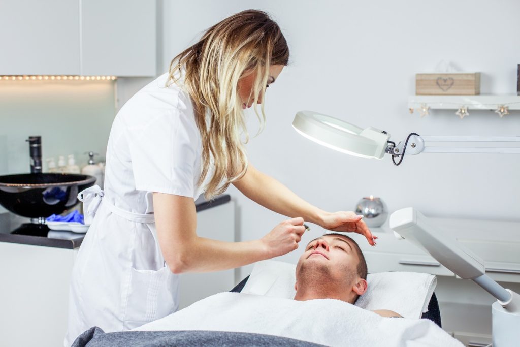 man undergoing facial treatment