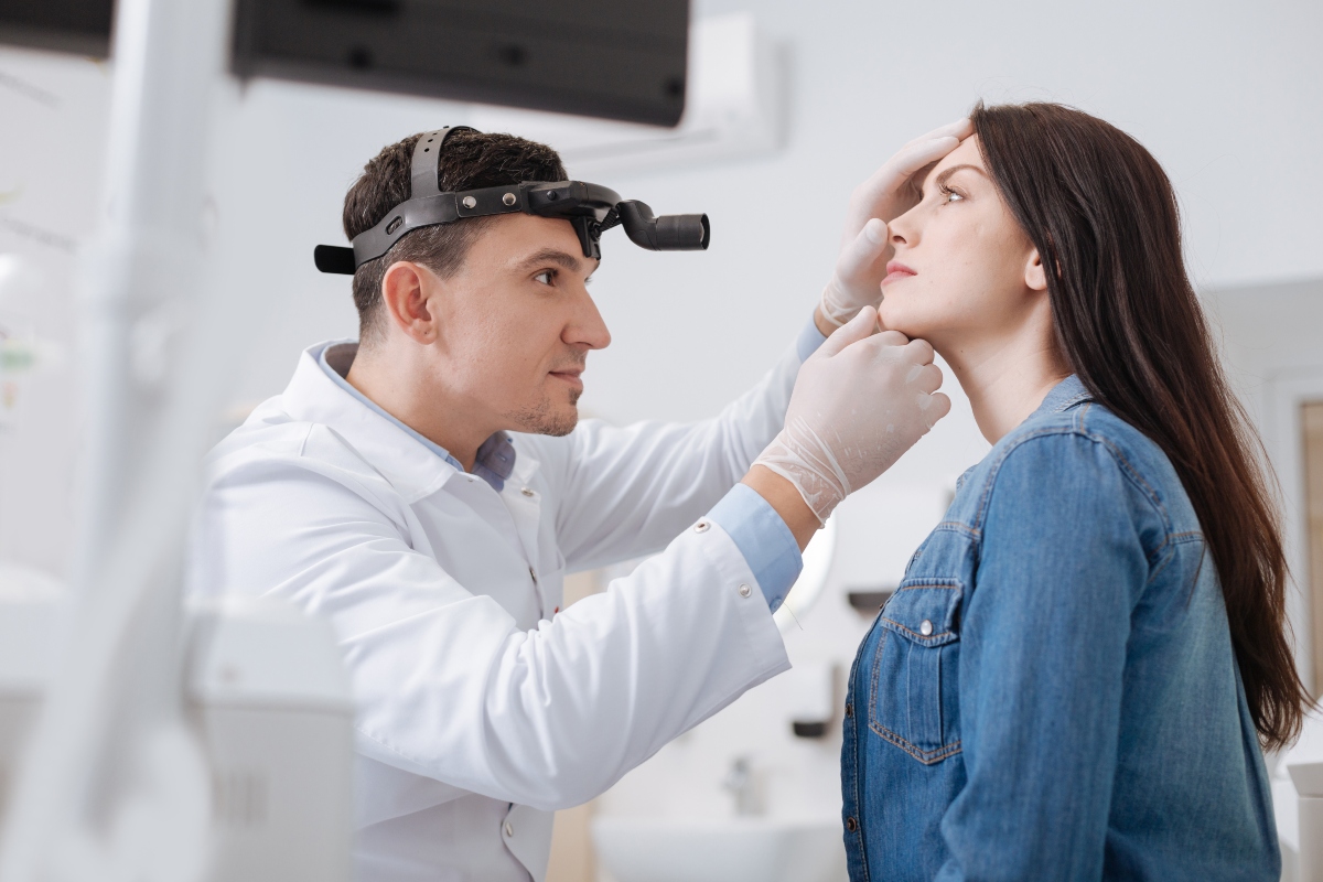 Doctor looking at the patient's nose