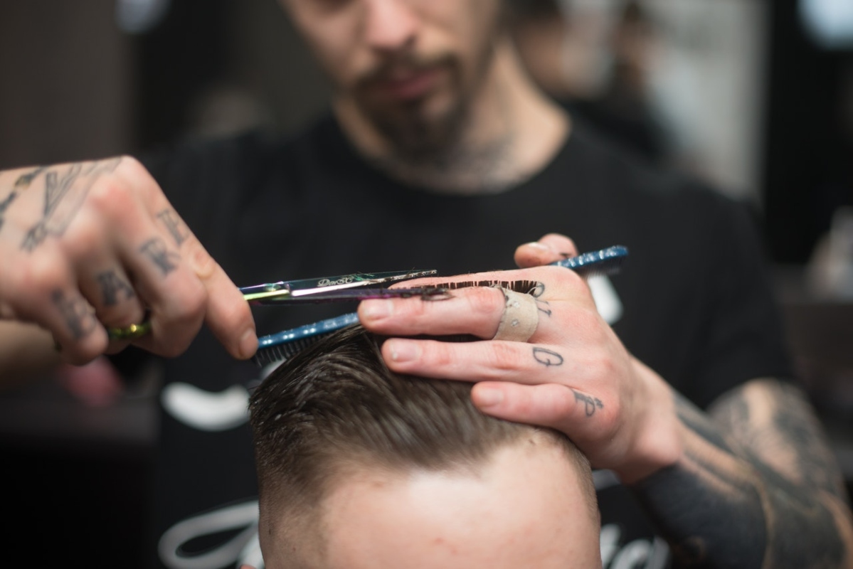 man getting his hair styled