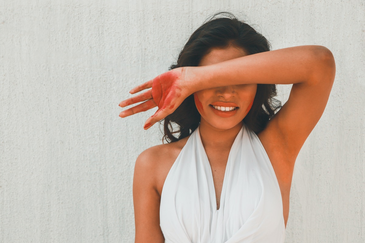 woman raising her arm