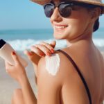 A Woman Applying Sunscreen